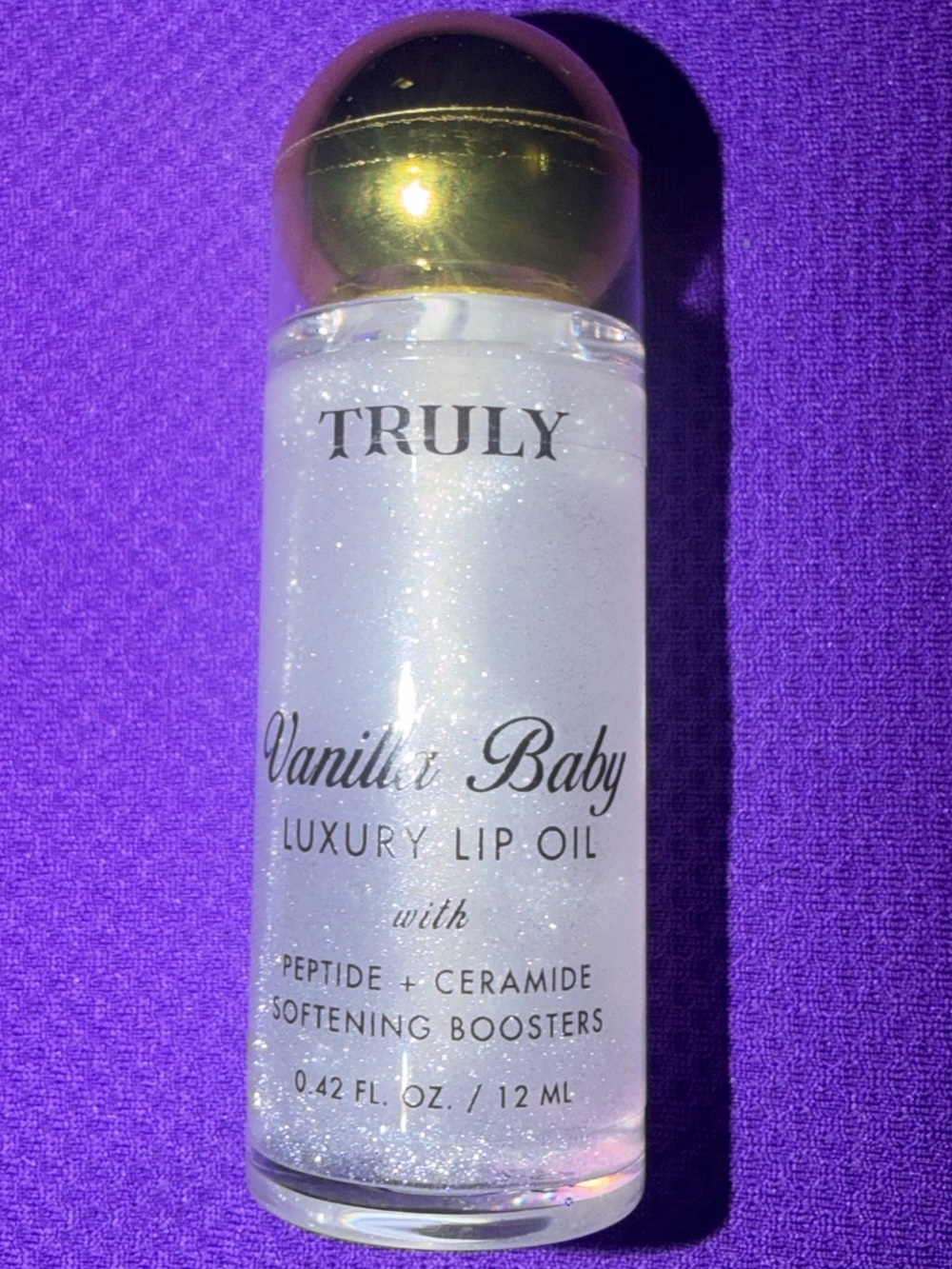 TRULY Vanilla Baby Luxury Lip Oil — Clear Shimmer with Gold Cap
